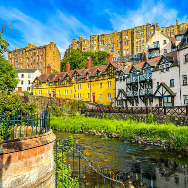 image of Dean Village Edinburgh. Yellow and white houses in a row in ...