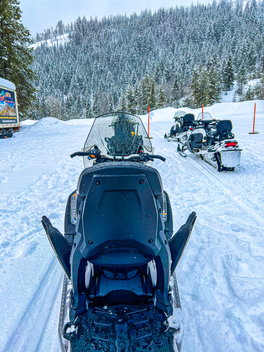 Image of back of black 'Ski-doo' snowmobile on snow