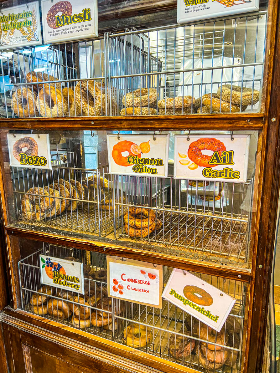 Image of freshly-baked fairmount bagels on shelves on display in Montreal