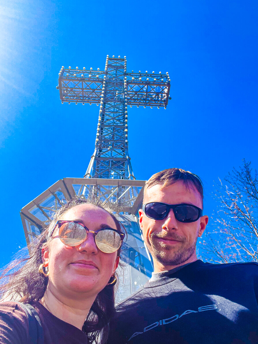Image of Shireen and Scott infront of Mount Royal Cross for Easy Montreal Hike Guide