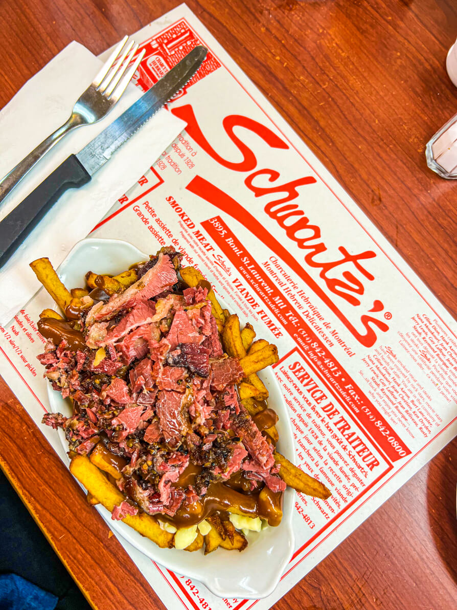 Bird's eye view of Schwartz poutine which is a Somebody Feed Phil filming location found in Montreal Canada