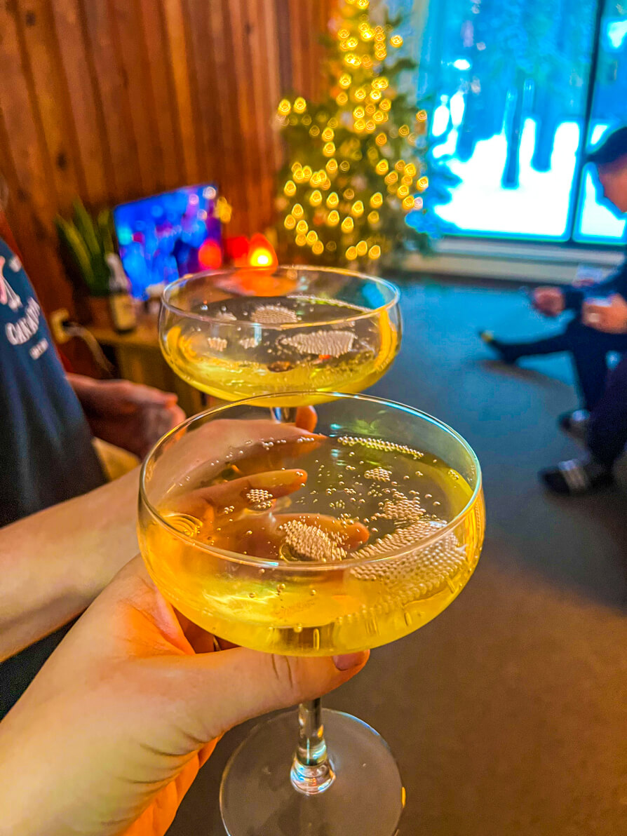 image of prosecco glasses in front of a christmas tree in Banff
