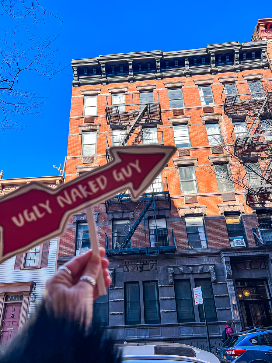 image of Ugly Naked Guy sign outside the apartment of FRIENDS NYC Location